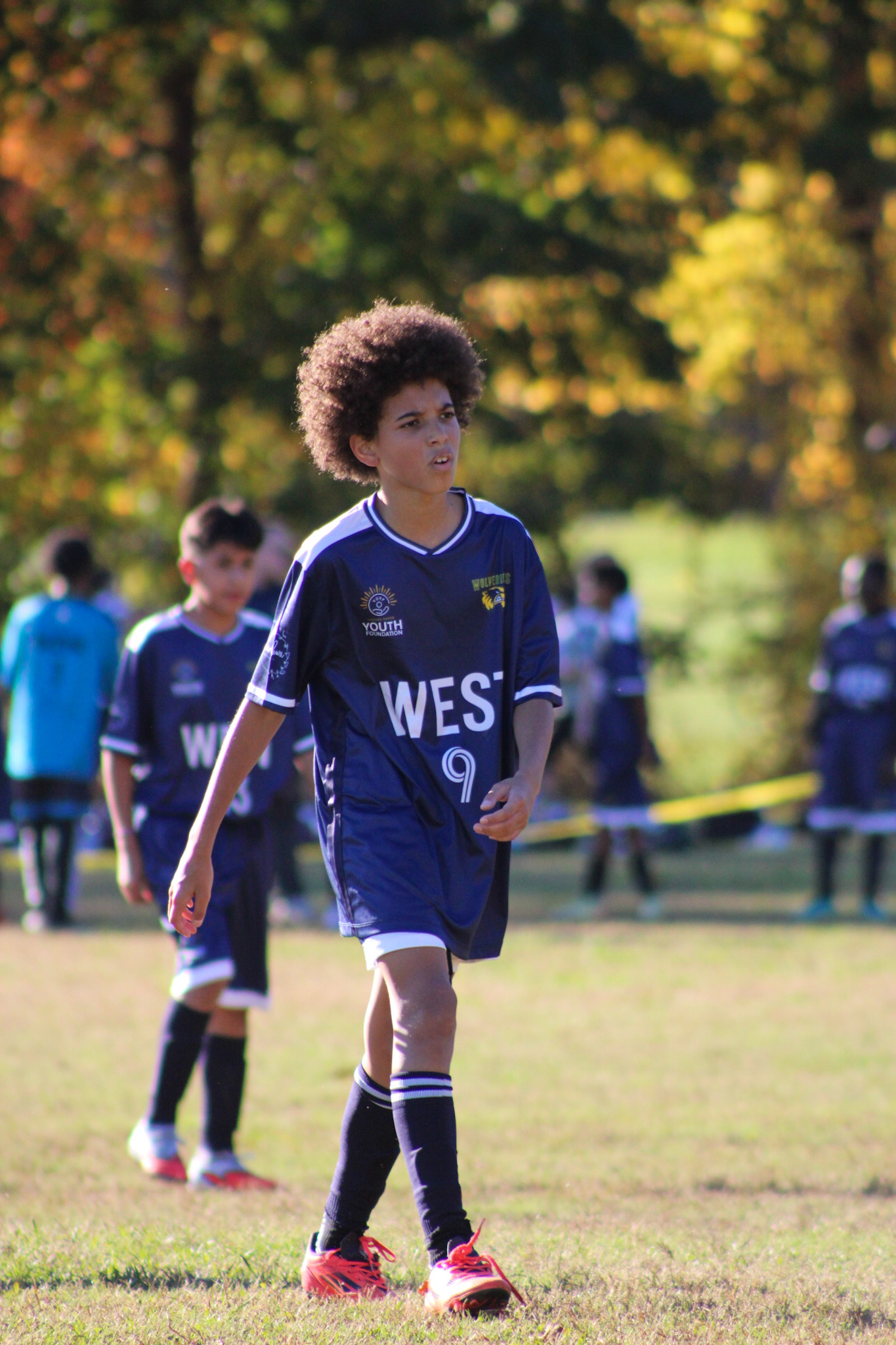 Youth player #9 on the field
